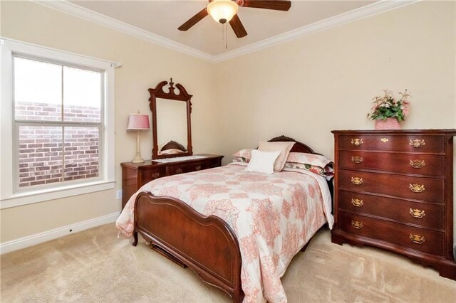 bedroom with ceiling fan, light carpet, and ornamental molding