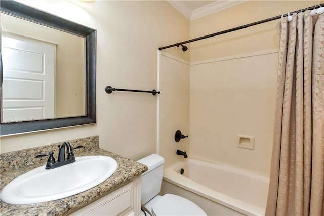 bathroom featuring ornamental molding, shower / bath combo, vanity, and toilet