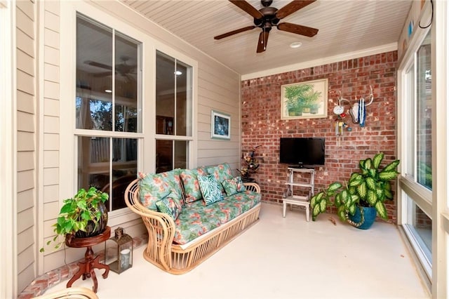 sunroom / solarium with a ceiling fan