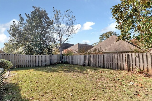 view of yard with a fenced backyard