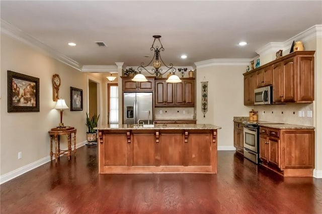 kitchen with dark wood-style flooring, appliances with stainless steel finishes, ornamental molding, light stone countertops, and a kitchen bar