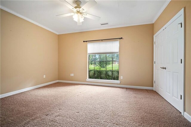 2000 Riverview Ave, Mobile, AL 36605 - unfurnished bedroom with crown molding, carpet, baseboards, and ceiling fan