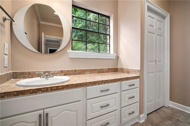 2000 Riverview Ave, Mobile, AL 36605 - bathroom featuring vanity, crown molding, and a closet