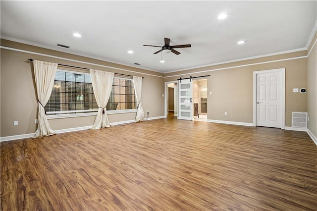2000 Riverview Ave, Mobile, AL 36605 - unfurnished living room featuring a ceiling fan, ornamental molding, wood finished floors, baseboards, and recessed lighting