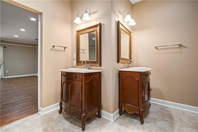 2000 Riverview Ave, Mobile, AL 36605 - full bath with two vanities, baseboards, and recessed lighting