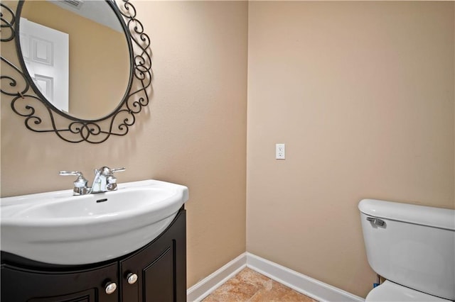2000 Riverview Ave, Mobile, AL 36605 - bathroom with baseboards, vanity, and toilet