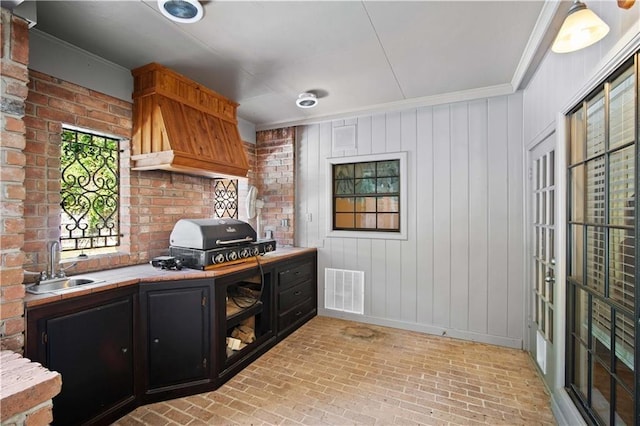 2000 Riverview Ave, Mobile, AL 36605 - office with brick flooring, a sink, crown molding, and baseboards