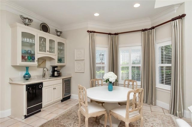 dining room with light tile patterned floors, wine cooler, wet bar, and crown molding