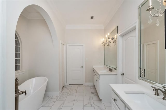 bathroom featuring a sink, baseboards, marble finish floor, and ornamental molding