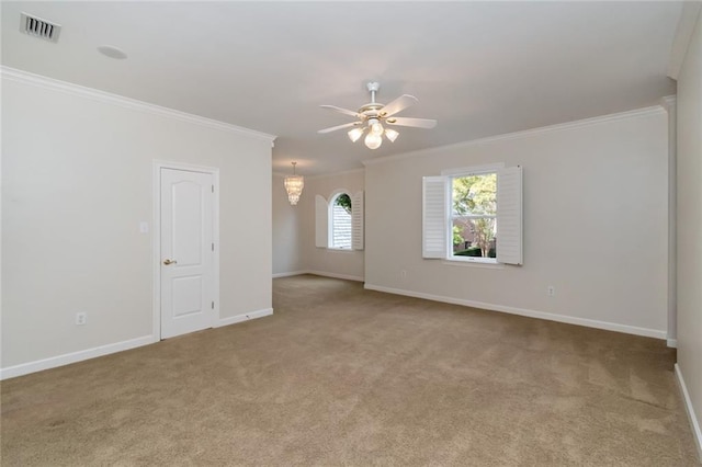 carpeted spare room featuring visible vents, ceiling fan with notable chandelier, crown molding, and baseboards