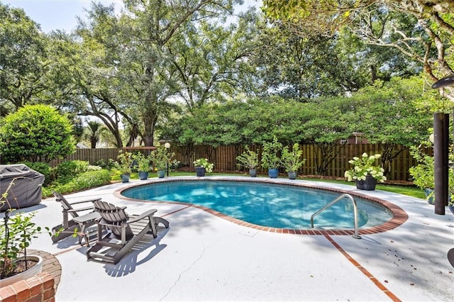 view of pool with a patio, a fenced in pool, and a fenced backyard