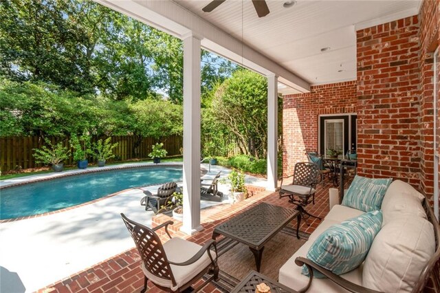 exterior space featuring a fenced in pool, a fenced backyard, a ceiling fan, and a patio area