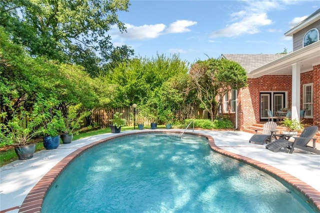 view of pool with a patio area and a fenced in pool