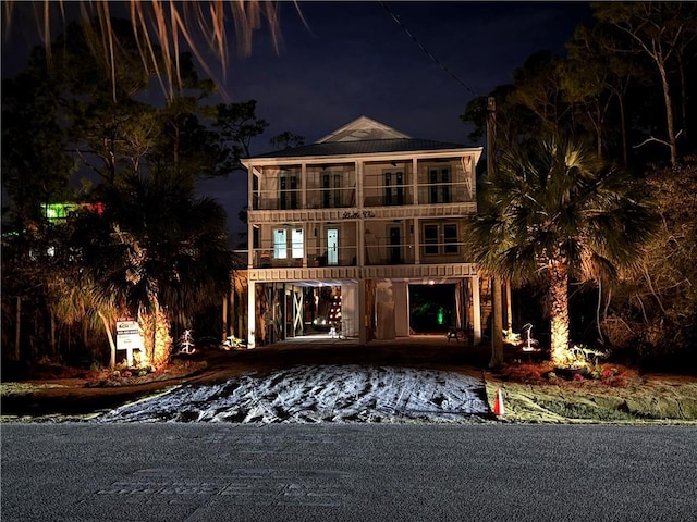 view of front of house featuring a balcony