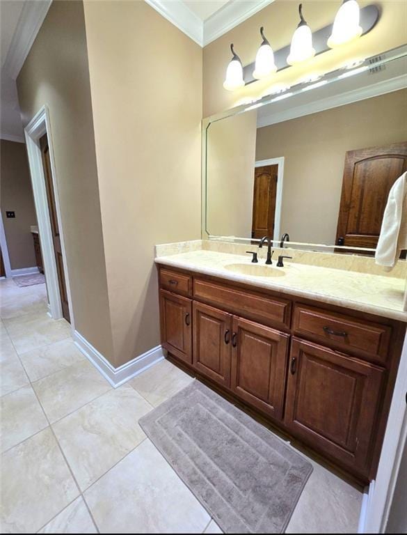 bathroom with tile patterned flooring, vanity, and ornamental molding