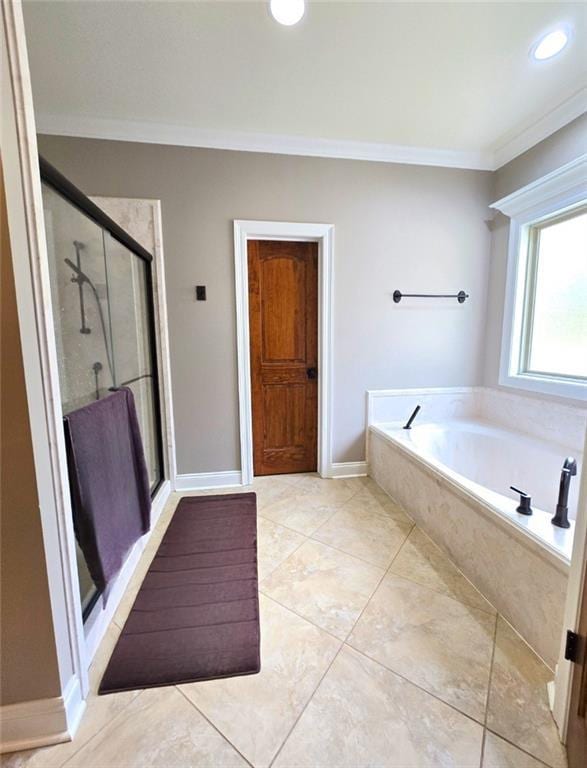 bathroom featuring plus walk in shower, tile patterned flooring, and ornamental molding