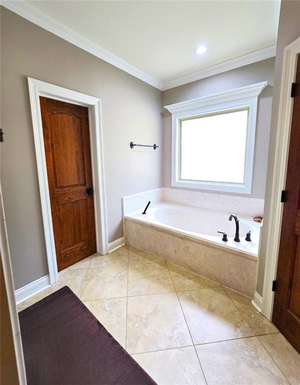 bathroom featuring tiled tub, tile patterned floors, and ornamental molding