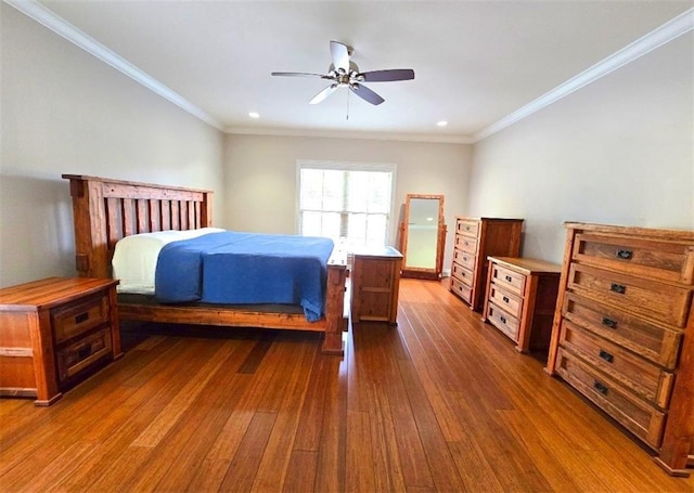 bedroom with ceiling fan, wood-type flooring, and ornamental molding