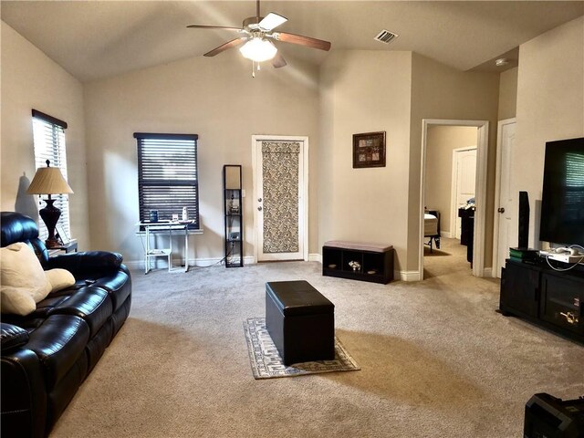 carpeted living area featuring visible vents, high vaulted ceiling, baseboards, and ceiling fan