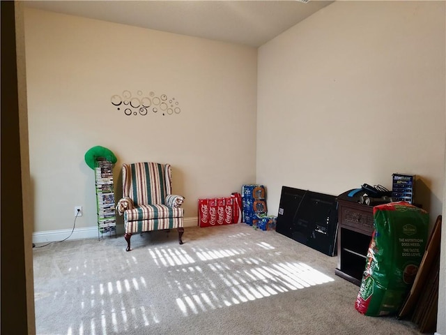recreation room featuring carpet flooring and baseboards