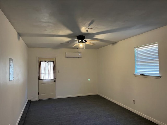 carpeted spare room with an AC wall unit and ceiling fan