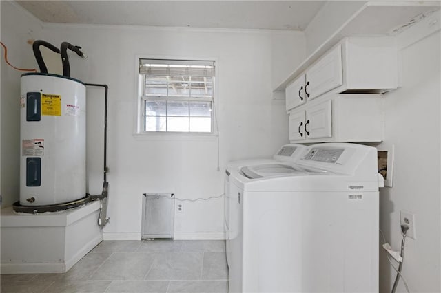 laundry room featuring cabinet space, baseboards, electric water heater, crown molding, and separate washer and dryer