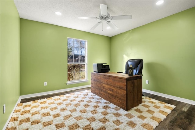 office area featuring baseboards, a ceiling fan, dark wood-style floors, a textured ceiling, and recessed lighting