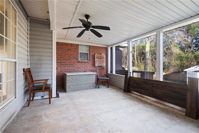 sunroom / solarium with a ceiling fan