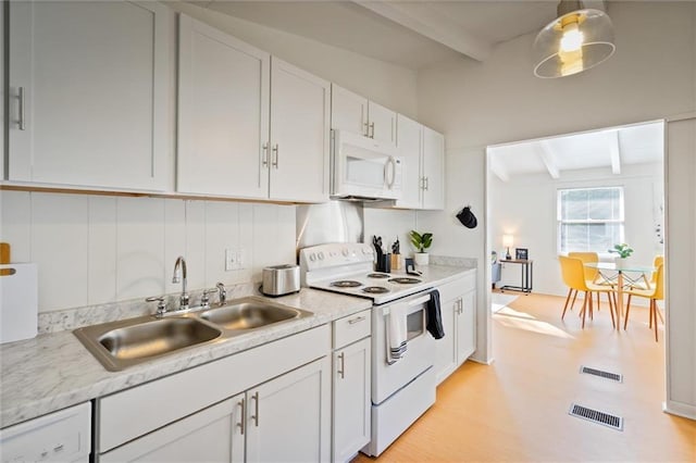 4054 Pringle Dr, Mobile, AL 36618 - kitchen with white appliances, beam ceiling, a sink, light countertops, and white cabinets