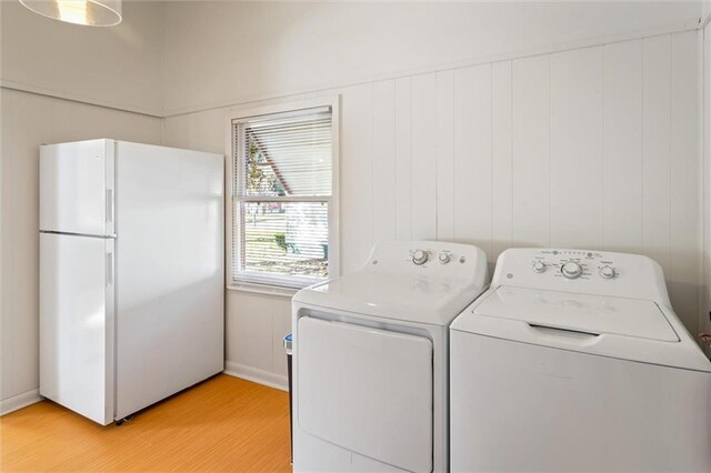 4054 Pringle Dr, Mobile, AL 36618 - laundry area with light wood-style floors and independent washer and dryer