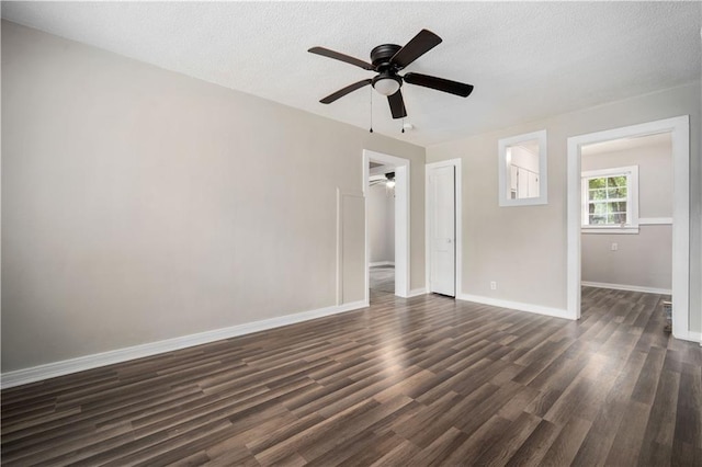 5015 Santos Dr W, Mobile, AL 36619 - spare room featuring a ceiling fan, dark wood-type flooring, baseboards, and a textured ceiling
