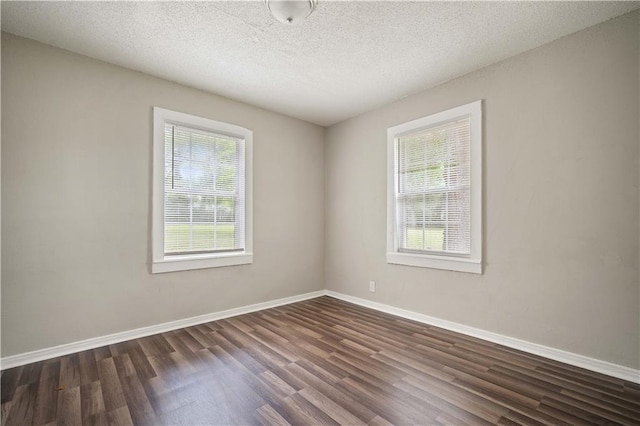 5015 Santos Dr W, Mobile, AL 36619 - unfurnished room featuring dark wood-style floors, baseboards, and a textured ceiling
