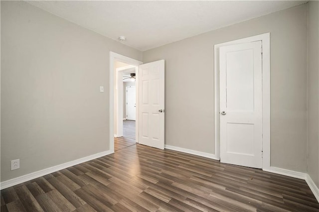 5015 Santos Dr W, Mobile, AL 36619 - unfurnished bedroom featuring dark wood finished floors and baseboards