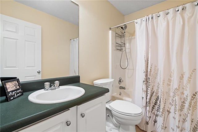 full bathroom with shower / bath combination with curtain, vanity, and toilet