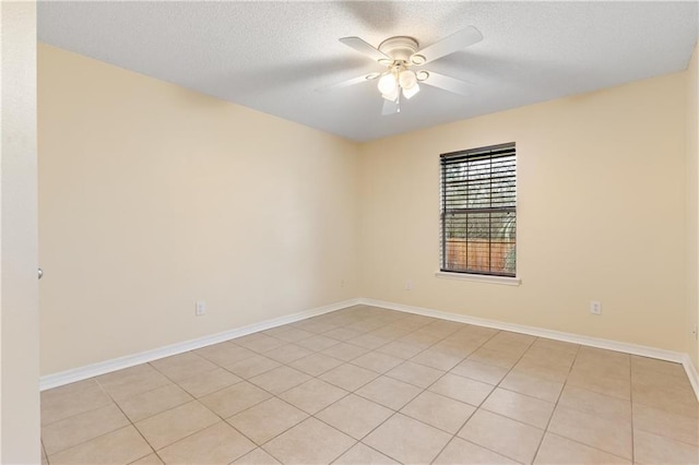 spare room featuring a textured ceiling and ceiling fan