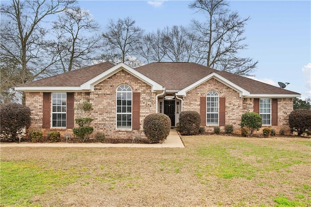 single story home with a front yard