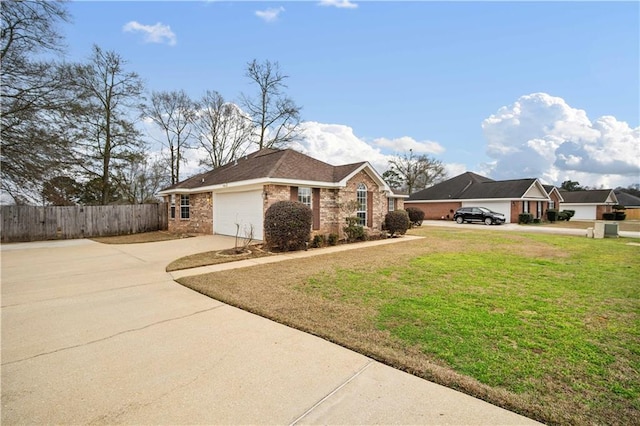 ranch-style home featuring a garage and a front yard