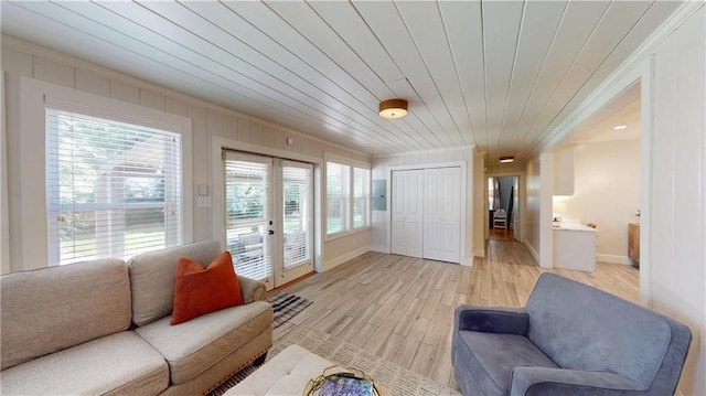 167 Glenwood St, Mobile, AL 36606 - living room featuring crown molding, plenty of natural light, light wood-style floors, baseboards, and wood ceiling