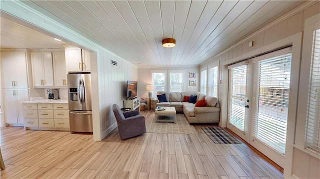 167 Glenwood St, Mobile, AL 36606 - living room featuring ornamental molding, light wood-type flooring, wooden ceiling, and french doors