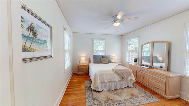 167 Glenwood St, Mobile, AL 36606 - bedroom with light wood-style floors, baseboards, and a ceiling fan