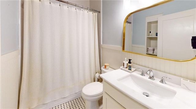 167 Glenwood St, Mobile, AL 36606 - bathroom featuring a wainscoted wall, toilet, and vanity
