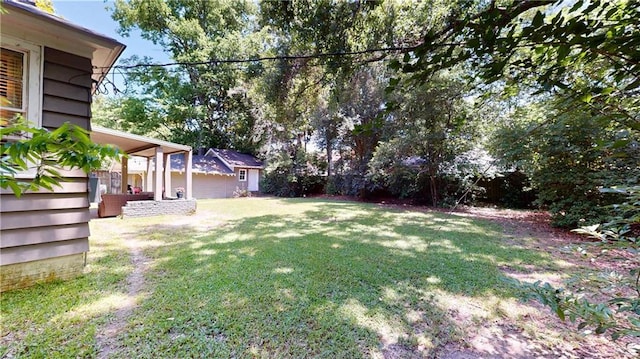 167 Glenwood St, Mobile, AL 36606 - view of green lawn with an outbuilding