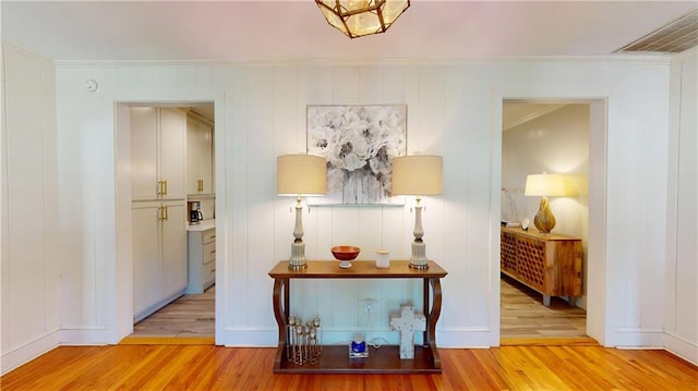 167 Glenwood St, Mobile, AL 36606 - corridor with wood finished floors, crown molding, and baseboards