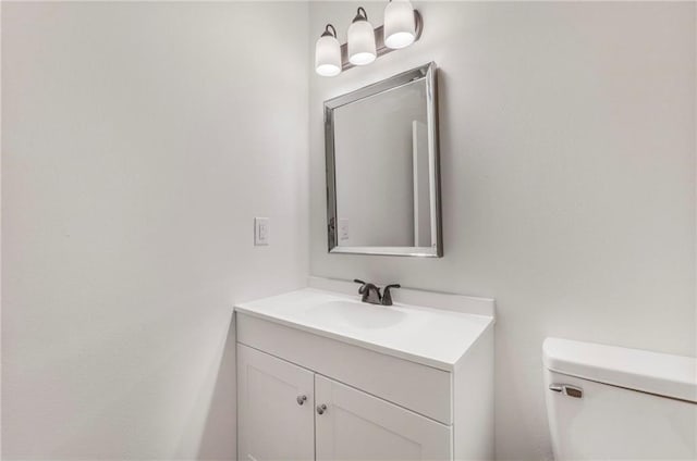 half bath with toilet and vanity