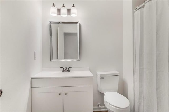 full bath featuring toilet and vanity