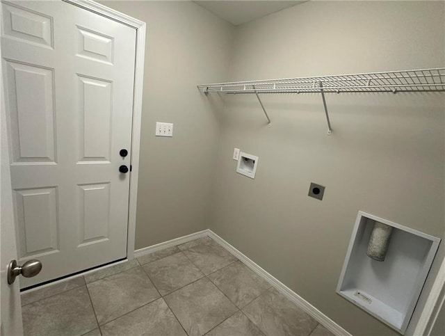 laundry area featuring light tile patterned floors, washer hookup, and hookup for an electric dryer