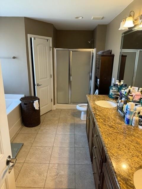 full bathroom featuring vanity, tile patterned floors, and plus walk in shower