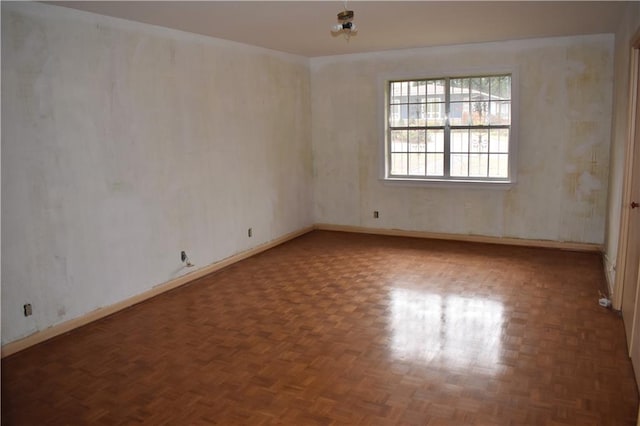 empty room featuring dark parquet floors