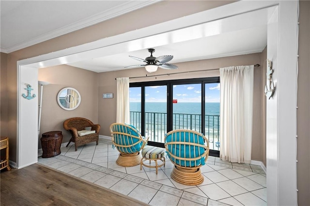 1051 Beach Blvd, Gulf Shores, AL 36542 - living area featuring a water view, tile patterned flooring, ornamental molding, and ceiling fan