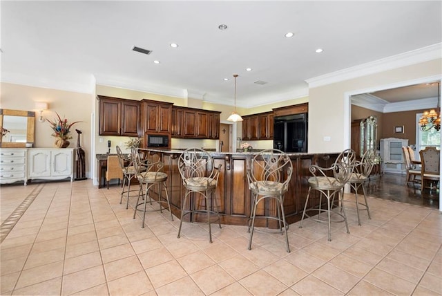2924 Riverview Pointe Dr S, Theodore, AL 36582 - kitchen with black appliances, light tile patterned flooring, crown molding, a breakfast bar area, and recessed lighting